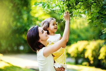 woman and child under tree