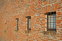 Red Brick Wall With Iron Lattice Window Of An Farm