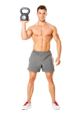 Wall Mural - Handsome man working with kettlebell on white