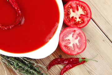 Wall Mural - tomato vegetable soup with basil and thyme