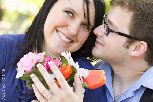 Fotografie, Obraz Attractive Young Man Gives Flowers to His Love