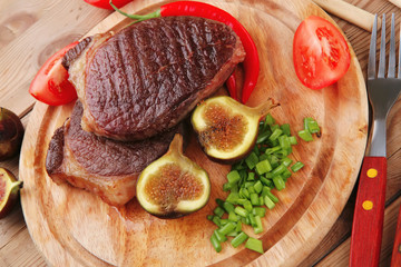 Wall Mural - grilled beefsteak served with hot cayenne peppers green stuff