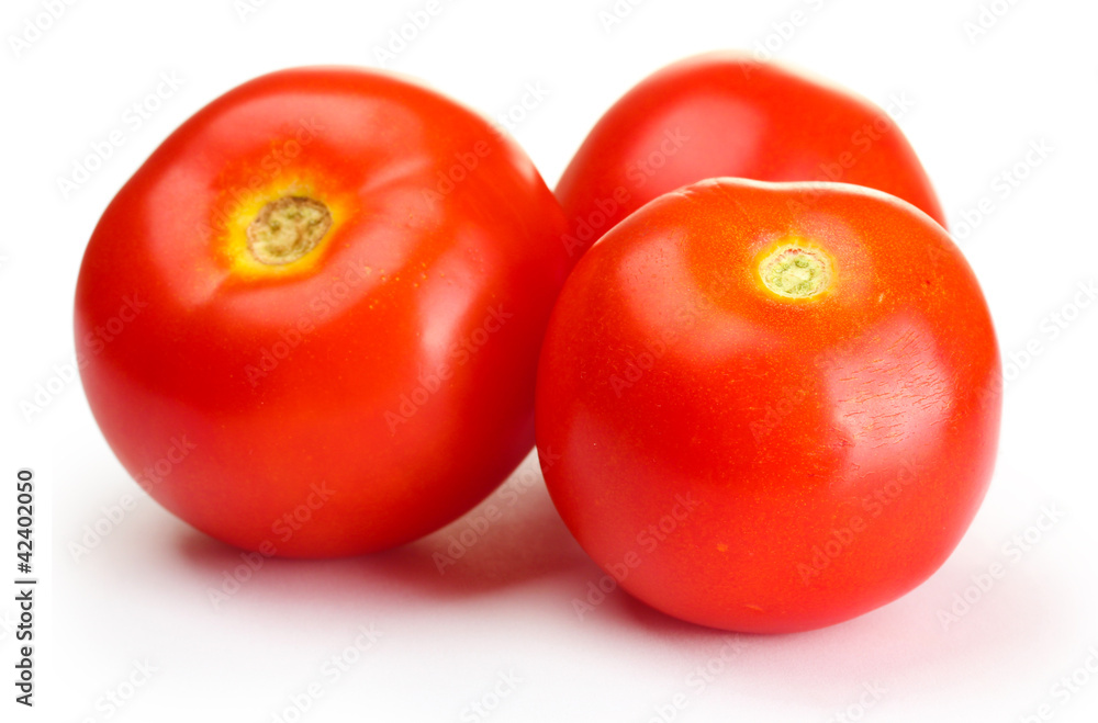 Ripe red tomatoes isolated on white