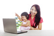© Creativa Images - Mother and Daughter with laptop computer