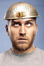 Portrait Of A Man With A Colander On His Head