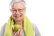 © nyul - Healthy old woman with green apple smiling