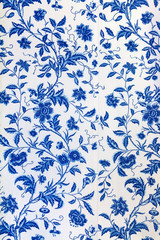 blue floral pattern on the wallpaper
