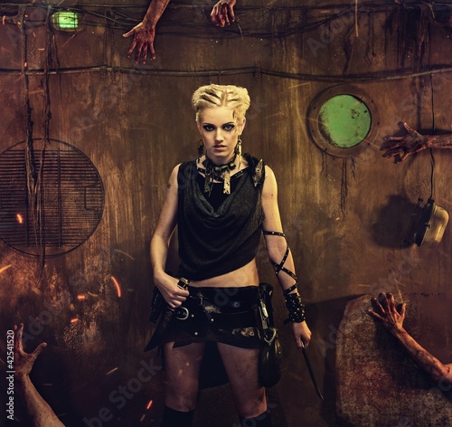 Fotoboard na płycie Kobieta w bunkrze z rękami zombie wokół niej