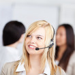 © contrastwerkstatt - junge blonde frau mit headset