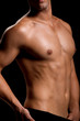© hannamonika - Healthy muscular young man. Isolated on black background.