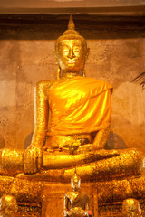 Wall Mural - Ancient golden buddha in Thai church.