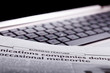 © Sergey Nivens - Notebook keyboard with a newspaper
