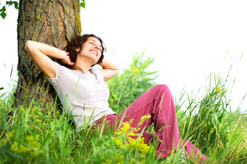 Wall Mural - beautiful young woman relaxing outdoors. nature