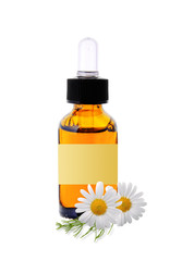 bottle with essence oil and chamomile flowers isolated on white