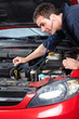 © grinny - Auto mechanic with a stethoscope .