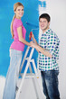 © .shock - happy couple paint wall at new home