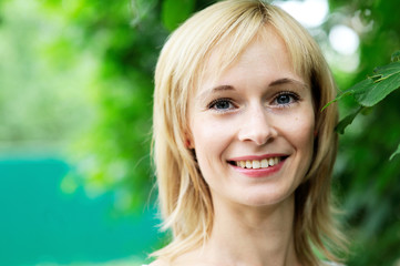 Close-up portrait of beautiful young blond woman