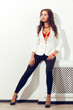 © chesterF - woman sitting over white wall