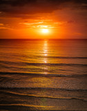 Fototapeta Zachód słońca - Sunrise in the sea with softwave and cloudy
