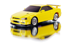 Yellow Toy Car And Its Reflection Isolated On White
