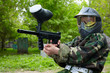 © Pavel Losevsky - Paintball player in camouflage uniform and protective mask