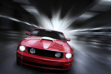 Luxury Red Sport Car Speeding In A Underground Parking