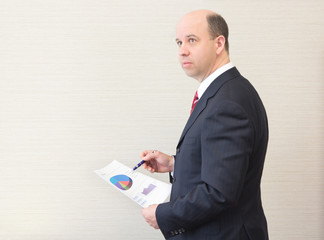 Business man holding a document