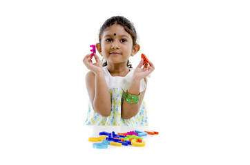 indian baby learning with alphabet blocks