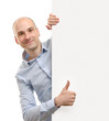 © spaxiax - man with blank banner showing thumbs up gesture