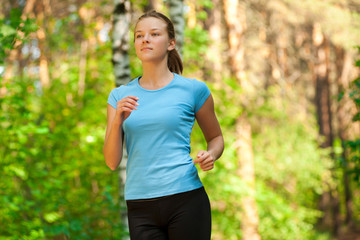 Young woman jogging in park