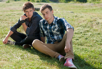 Sticker - Two handsome young men sitting side by side