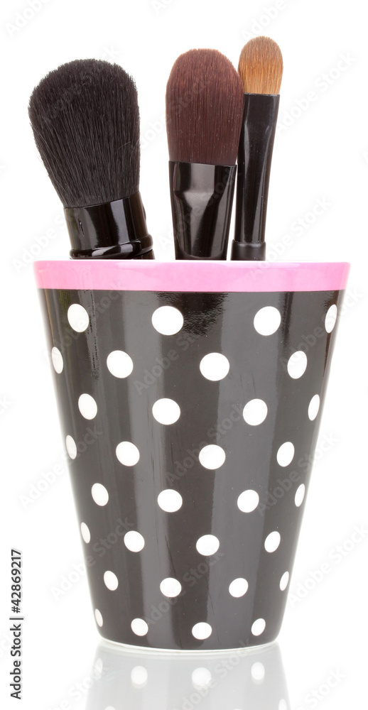 Cosmetic brushes in cup isolated on white