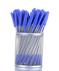 blue pens in metal cup isolated on white