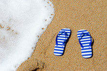 Striped Flip Flops At The Beach