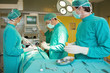 © Wavebreak Media - Serious surgeons operating