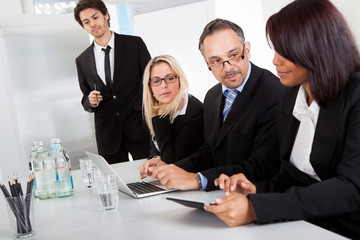 Wall Mural - Group of business people at presentation