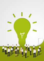 Green template in shape of light bulb idea with business people