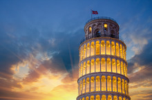 Tower Of Pisa In Miracles Square, Illuminated At Night With Suns