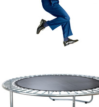 Businessman Bouncing On A Trampoline On White