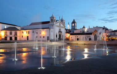 Fototapete - Lagos town square with fountains at dusk. Algarve Portugal