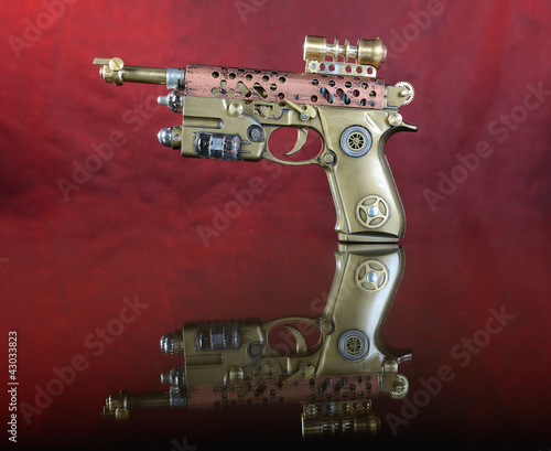 Obraz na płótnie canvas trzyczęściowy "tryptyk" Steampunk armata ręczna.