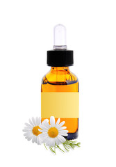 bottle with essence oil and chamomile flowers isolated on white