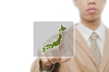 Businessman point finger on japan map with embeded flag