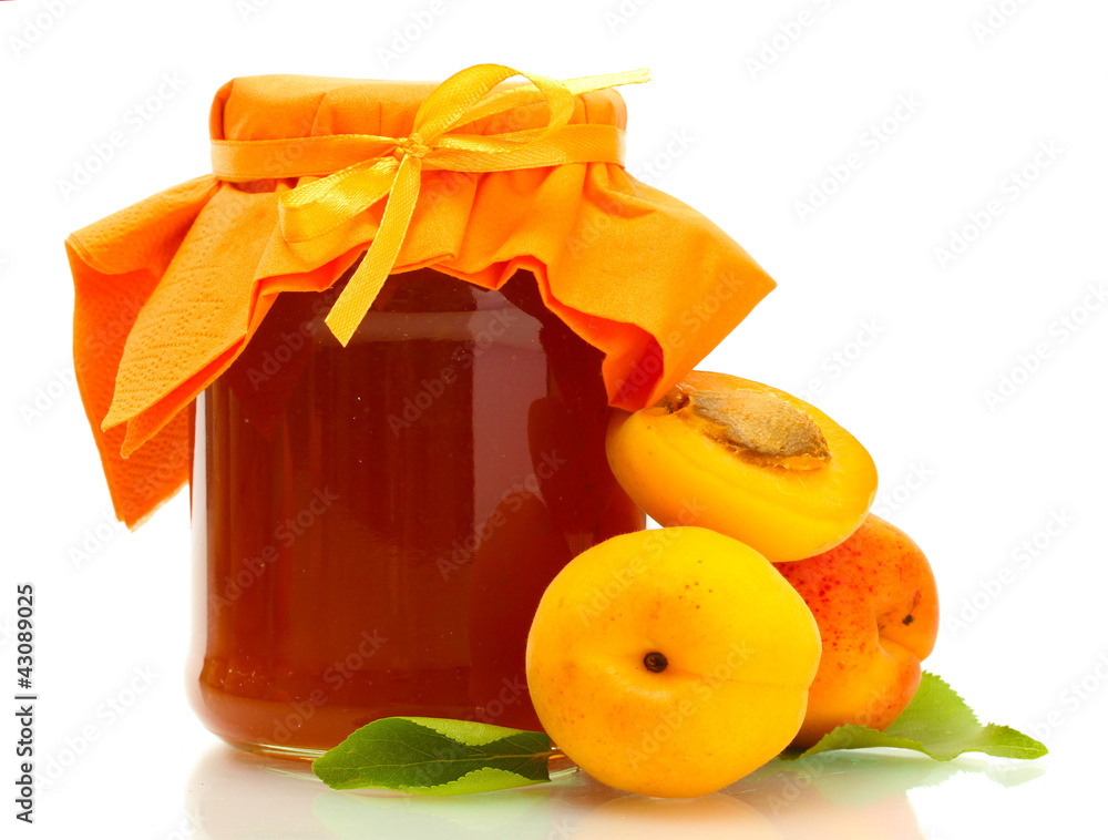 Apricot jam in a jar and sweet apricots isolated on white