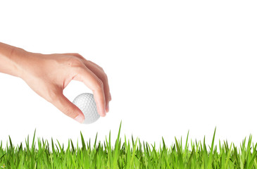 Wall Mural - Close-up of hand holding golf ball with green grass for web desi