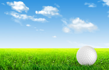 Close-up of golf ball with green grass for web design background