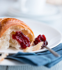 Wall Mural - Close up of croissant with sour cherry jam