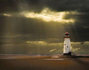 Wall Mural - lighthouse in the afterglow of a storm at sea