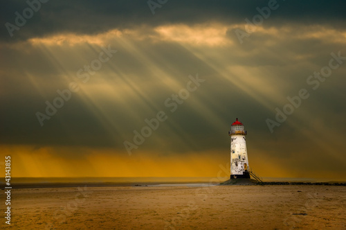 Fotomural lighthouse as the storm breaks