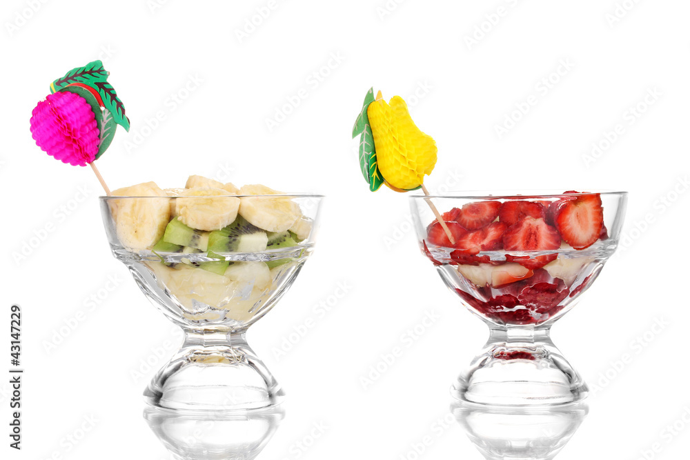 Mixed fruits and berries in glasses isolated on white